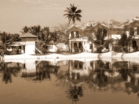 View of the cottages and lagoon water in Alleppey, Kerala, India