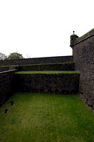 The depth of the moat, now covered with grass at the entrance