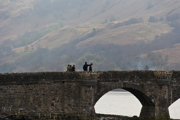 Tourists on the bridge coming back from Eilean Donan Castle in S