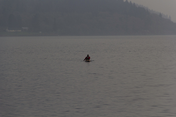 Man kayaking on the water of the Loch Ness in the Scottish Highl
