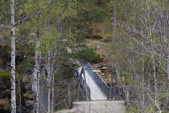 View from a distance of the small wooden bridge over the Corries
