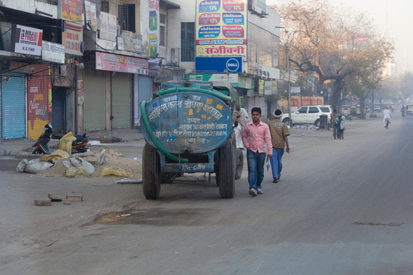 Water tanker and people on the streets of Jodhpur in the morning