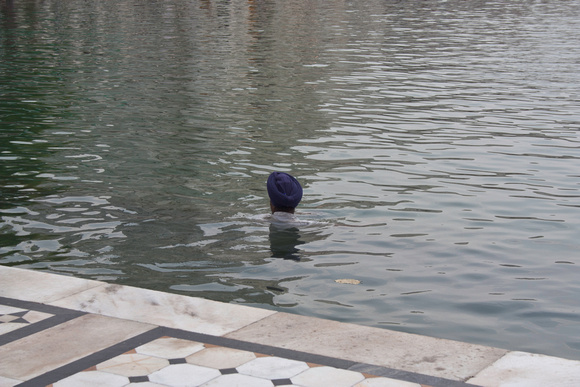 Cleaning the sarovar in the Golden Temple in India