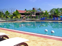 Pool with balls, and cottages in the resort in Alleppey, Kerala,
