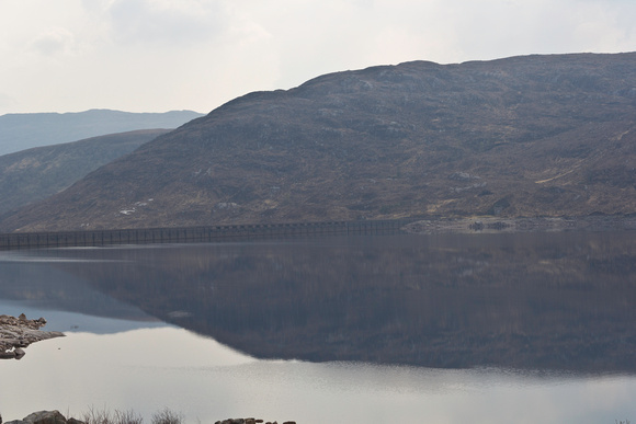 Loch and reflection of hills in the Scottish Highlands