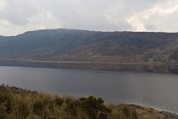 Narrow portion of Loch and rugged outdoors in the Scottish Highl