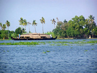 A houseboat on its quiet sojourn through the backwaters of Allep