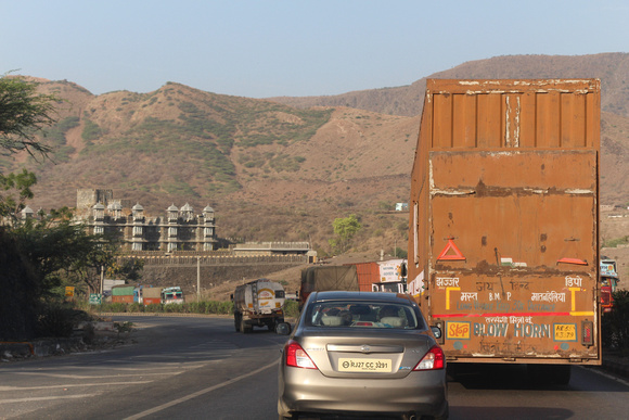 Car and trucks on the highway on the outskirts of Udaipur
