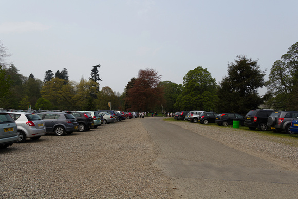 Parked vehicles and people walking inside the Blair Drummond saf