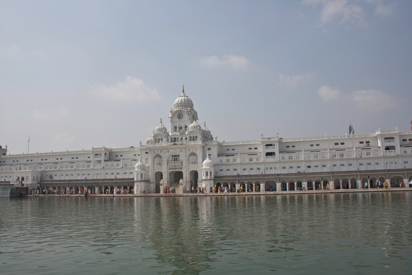 White clocktower building inside the Golden Temple in Amritsar, India