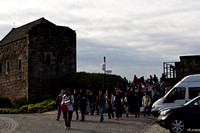 A whole mass of tourists inside Edinburgh Castle, descending fro