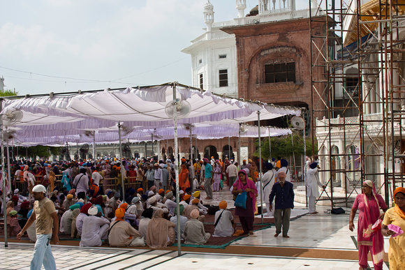 Seated devotees inside the Golden Temple in Amritsar in India