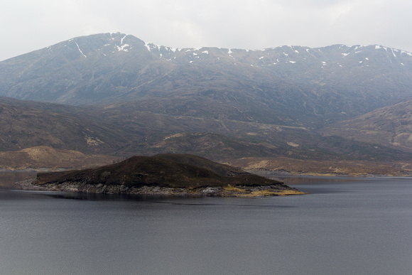 Island in the middle of a Loch and rugged outdoors in the Scotti