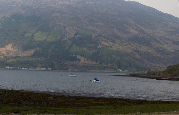Enjoying with a boat and sailboat in a Loch in the Scottish High