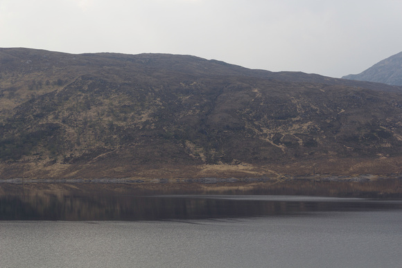 Water of Loch, hills and rugged outdoors in the Scottish Highlan